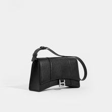 Load image into Gallery viewer, Side view of the BALENCIAGA Hourglass Baguette Grained Leather Shoulder Bag