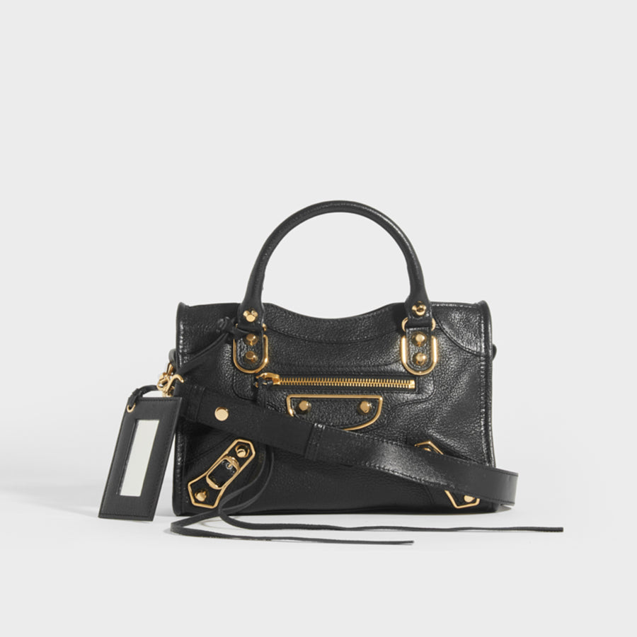 BALENCIAGA Mini City Bag With Gold Hardware in Black Leather with top handles and cross body strap - Front View