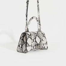 Load image into Gallery viewer, Side view of the BALENCIAGA Small Hourglass Top Handle Bag in Python Print