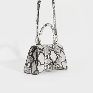 Side view of the BALENCIAGA Small Hourglass Top Handle Bag in Python Print