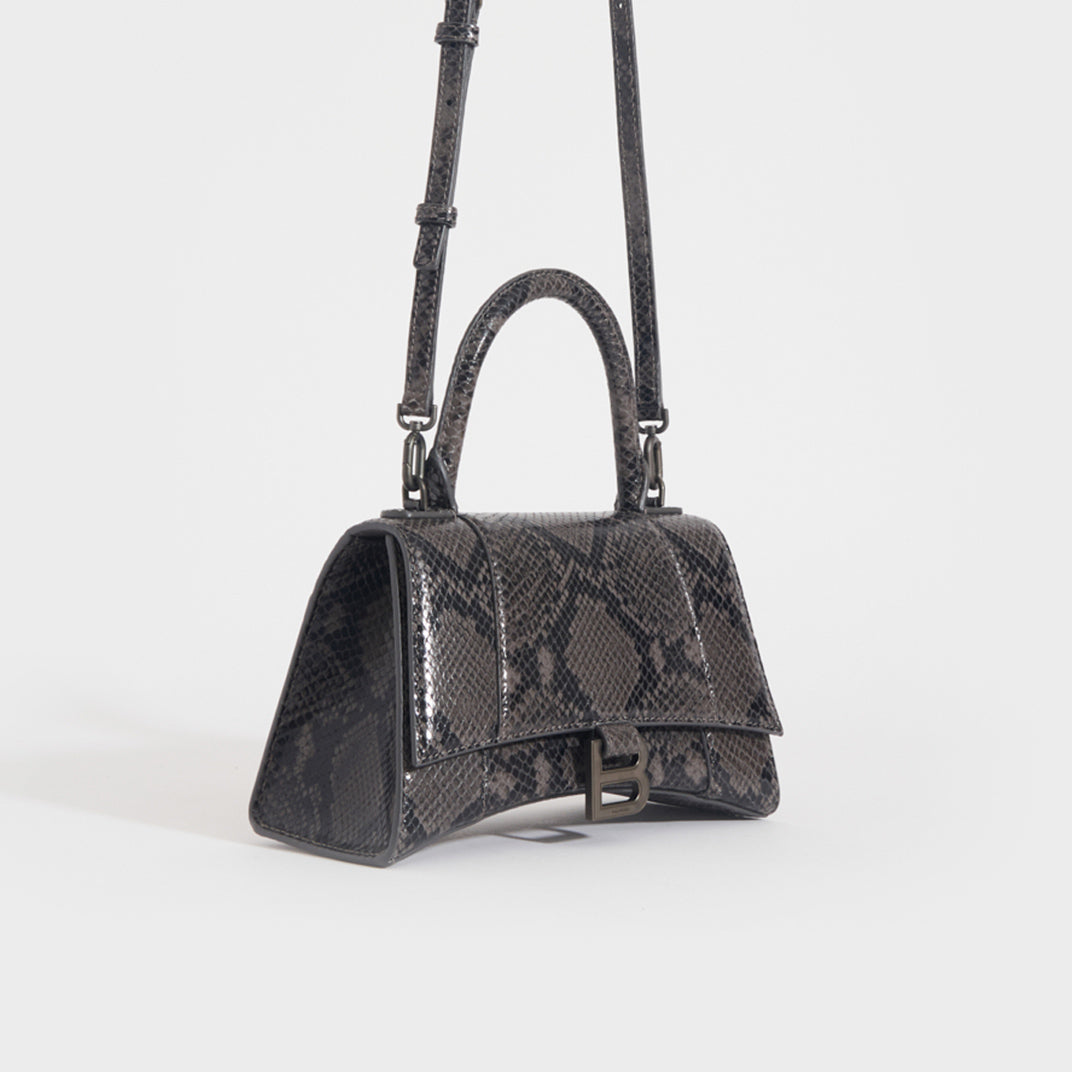 Side of the BALENCIAGA Small Hourglass Top Handle Snakeskin-Effect Leather Bag in Dark Grey and Black