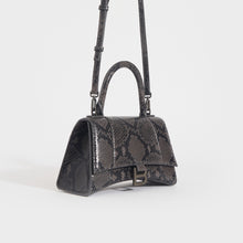Load image into Gallery viewer, Side of the BALENCIAGA Small Hourglass Top Handle Snakeskin-Effect Leather Bag in Dark Grey and Black