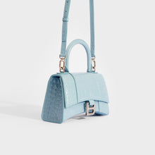 Load image into Gallery viewer, Side view of the BALENCIAGA XS Hourglass Top Handle Bag in Blue Grey Embossed Croc