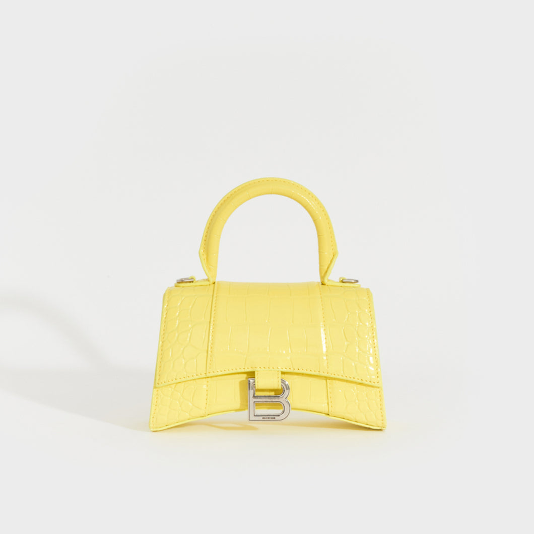 Front view of the BALENCIAGA XS Hourglass Top Handle Bag in Light Yellow Embossed Croc