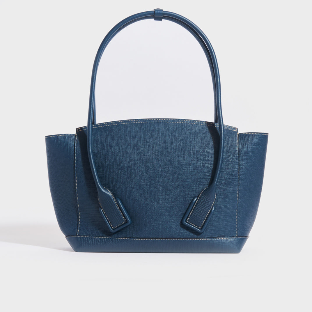 Rear view of the BOTTEGA VENETA Arco Large Leather Tote Bag in Deep Blue  grained leather