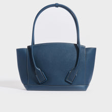 Load image into Gallery viewer, Rear view of the BOTTEGA VENETA Arco Large Leather Tote Bag in Deep Blue  grained leather