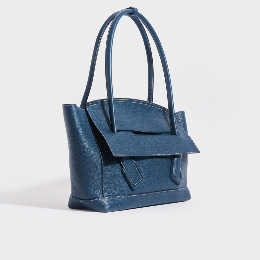 Side view of the BOTTEGA VENETA Arco Large Leather Tote Bag in Deep Blue