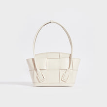 Load image into Gallery viewer, Rear view of the BOTTEGA VENETA Arco Small Intrecciato Leather Tote Bag in White