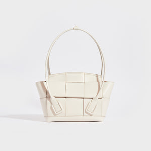 Front of the BOTTEGA VENETA Arco Small Intrecciato Leather Tote Bag in White