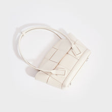 Load image into Gallery viewer, Top down view of the BOTTEGA VENETA Arco Small Intrecciato Leather Tote Bag in White