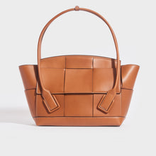 Load image into Gallery viewer, Front view of the BOTTEGA VENETA Arco Large Intrecciato Leather Tote Bag in Wood