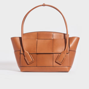 Front view of the BOTTEGA VENETA Arco Large Intrecciato Leather Tote Bag in Wood