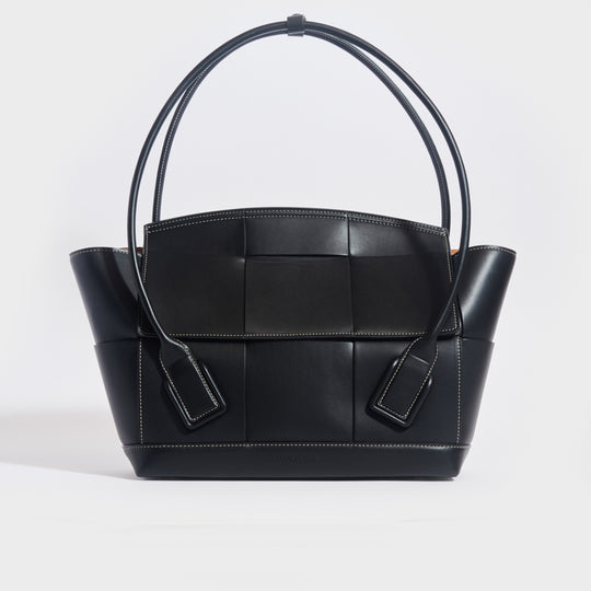 Front view of the BOTTEGA VENETA Arco Large Intreccio Leather Tote Bag in Black