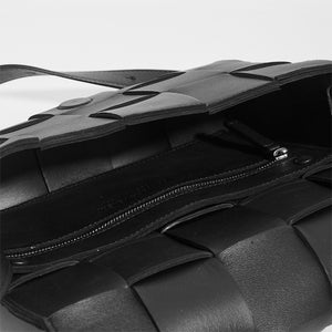 Inside of BOTTEGA VENETA Cassette Maxi Intrecciato Bag in Black Leather with inside zip detail