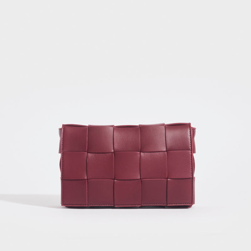 Front view of the BOTTEGA VENETA Cassette Maxi Intrecciato Bag in Bordeaux