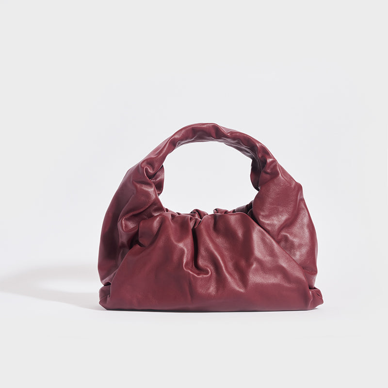 Front view of the BOTTEGA VENETA Medium Shoulder Pouch Leather Bag in Bordeaux