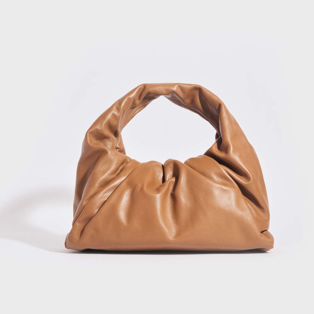 Back view of the BOTTEGA VENETA Medium Shoulder Pouch Leather Bag in Camel