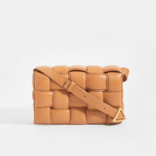 Load image into Gallery viewer, Front view of BOTTEGA VENETA Padded Cassette Crossbody Bag in Caramel Lambskin Leather