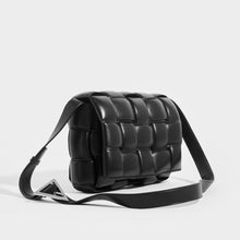 Load image into Gallery viewer, Side view of the Front view of the BOTTEGA VENETA Padded Cassette Bag in Black (Nero) with Silver Hardware