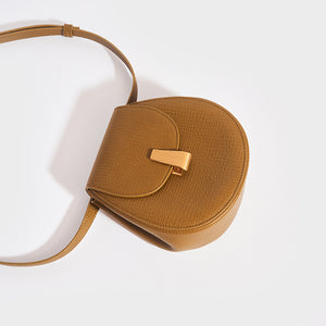 BOTTEGA VENETA Palmellato Rounded Leather Belt Bag in Mustard