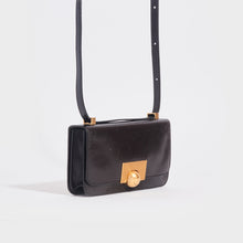 Load image into Gallery viewer, Side view of the BOTTEGA VENETA The Classic Mini Leather Shoulder Bag in Fondente