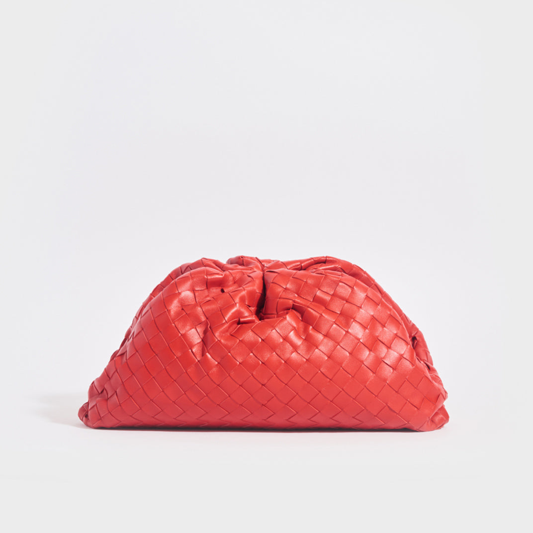Front view of the BOTTEGA VENETA The Pouch Intrecciato Leather Clutch in Red