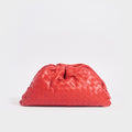 Front view of the BOTTEGA VENETA The Pouch Intrecciato Leather Clutch in Red