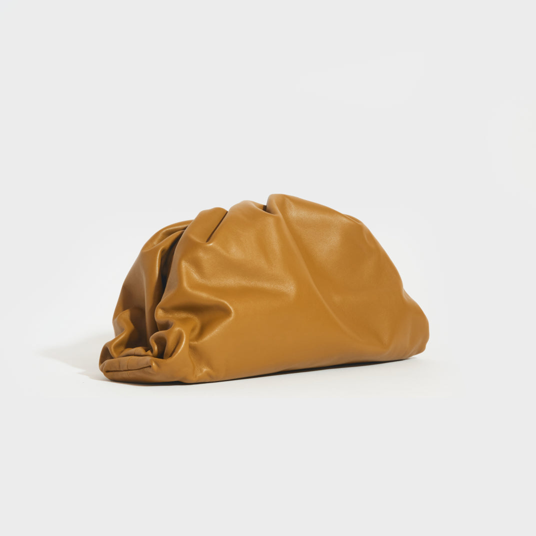 BOTTEGA VENETA The Pouch Leather Clutch in Moutarde COCOON