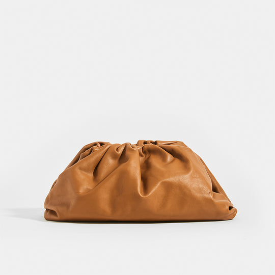 Front view of the BOTTEGA VENETA The Pouch Leather Clutch in Cammello