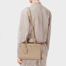Load image into Gallery viewer, Model wearing the BURBERRY Mini Frances Bag in Oat Beige Grainy Leather