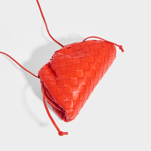 Top view of the BOTTEGA VENETA The Pouch 20 Intrecciato Crossbody in Bright Red - Rent a Bottga bag today