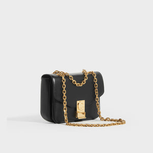 Side view of CELINE Small C Bag in Polished Black Calfskin