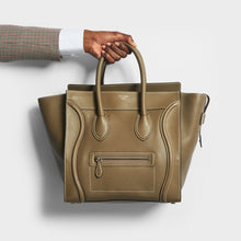 Load image into Gallery viewer, Model holding the CELINE Mini Luggage Handbag in Grey Calfskin