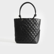 Load image into Gallery viewer, Front view of Chanel cambon ligne diamond quilted tote back in black made of leather from 2003-2004