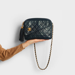 Model shot of the CHANEL Vintage CC Diamond Quilted Tassel Crossbody Bag in Navy 1991 - 1994