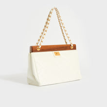 Load image into Gallery viewer, Side view of the CHANEL Quilted Caviar Wood Shoulder Bag with Chain in White 2003 - 2004