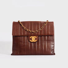 Load image into Gallery viewer, Front view of the CHANEL Vertical Quilted Jumbo Flap Bag in Chocolate Brown Lambskin 1994
