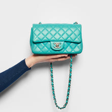 Load image into Gallery viewer, Model holding the CHANEL Single Flap Single Chain Bag in Turquoise Lambskin 2014
