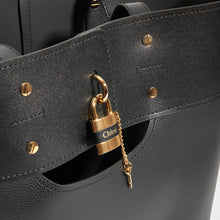 Load image into Gallery viewer, Lock detail on CHLOÉ Aby Large Smooth and Grained Leather Tote in Black