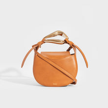 Load image into Gallery viewer, Front of the CHLOÉ Kiss Small Leather Tote in Tan with metallic top handle and leather shoulder strap