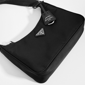 Close up of Prada Hobo Re-Edition 2000 nylon bag black with silver hardware