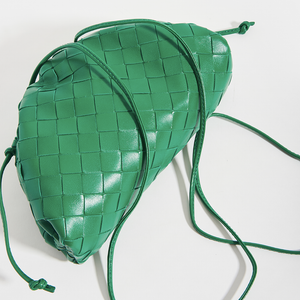 Top-down detail shot of the BOTTEGA VENETA The Pouch 20 Intrecciato Crossbody in Green