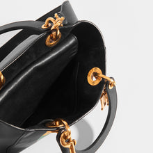 Load image into Gallery viewer, Inside view of DIOR Vintage Lady Dior Wheel of Fortune Bag in Black leather