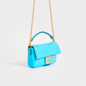 Side view of the FENDI Mini Baguette Bag in Turquoise Embossed Leather