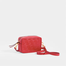 Load image into Gallery viewer, Side view of the FENDI Mini Camera Case Crossbody Bag with cross body strap