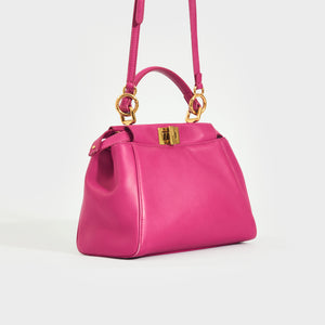 Side view of the FENDI Mini Peekaboo Handbag in Pink