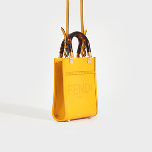Side view of the FENDI Sunshine Mini Shopper Bag in Yellow