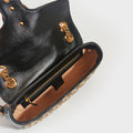 Inside view of the GUCCI GG Marmont Small Shoulder Bag in Original GG Canvas