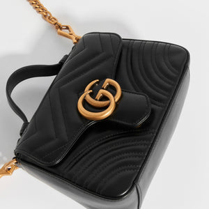 Top of GUCCI Mini GG Marmont Top Handle Bag in Quilted Black Leather