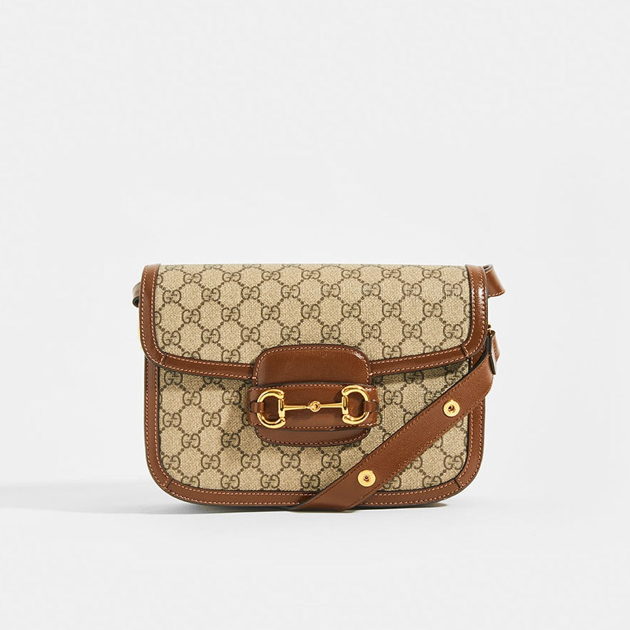 The GUCCI 1955 Horsebit Shoulder Bag in Canvas with Brown Leather Trim With Gold 'Horsebit' Hardware and Adjustable strap